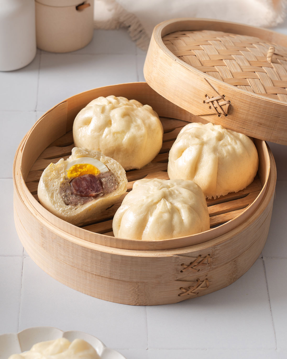 A steamer filled with banh baos.