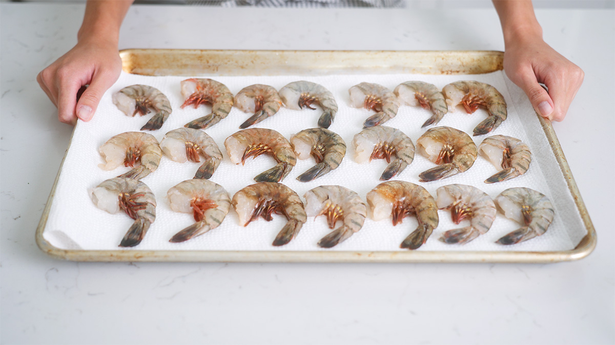 A tray of freshly prepared and cleaned shrimps.