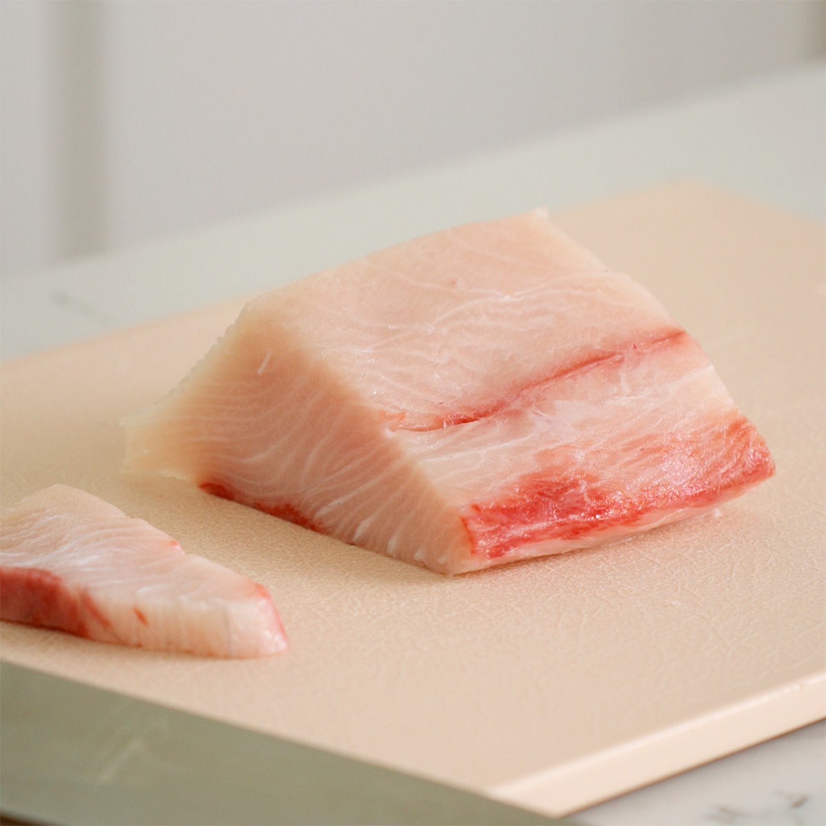 A chunk of sashimi grade hamachi yellowtail.