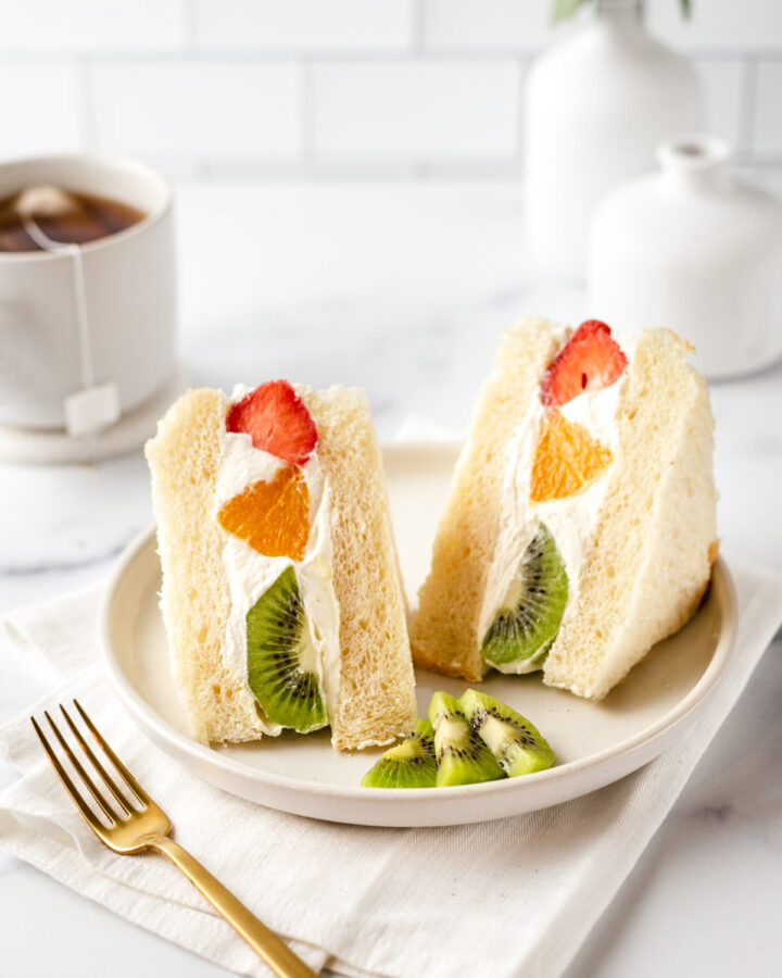 Japanese fruit sandwiches with tangerines, strawberries, and kiwis inside.