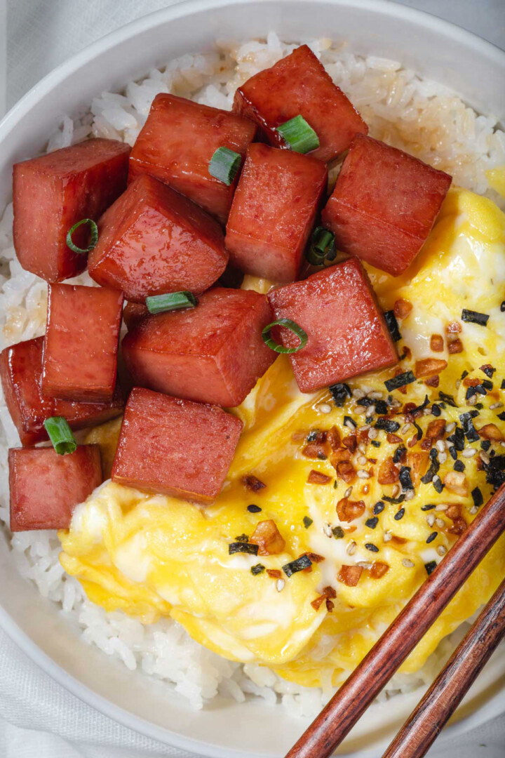 Close up of spam and eggs in a bowl.