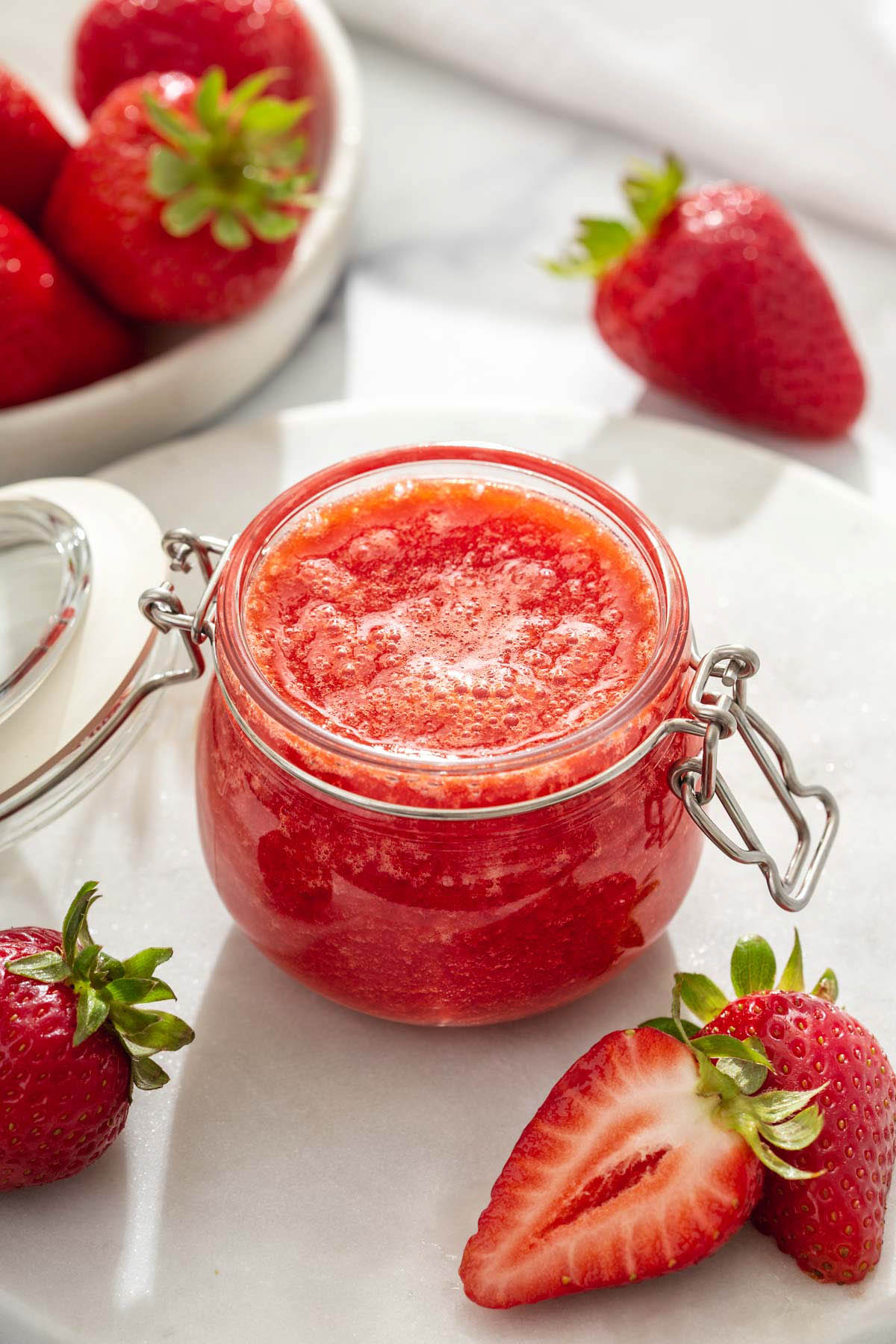 A jar of homemade strawberry sauce