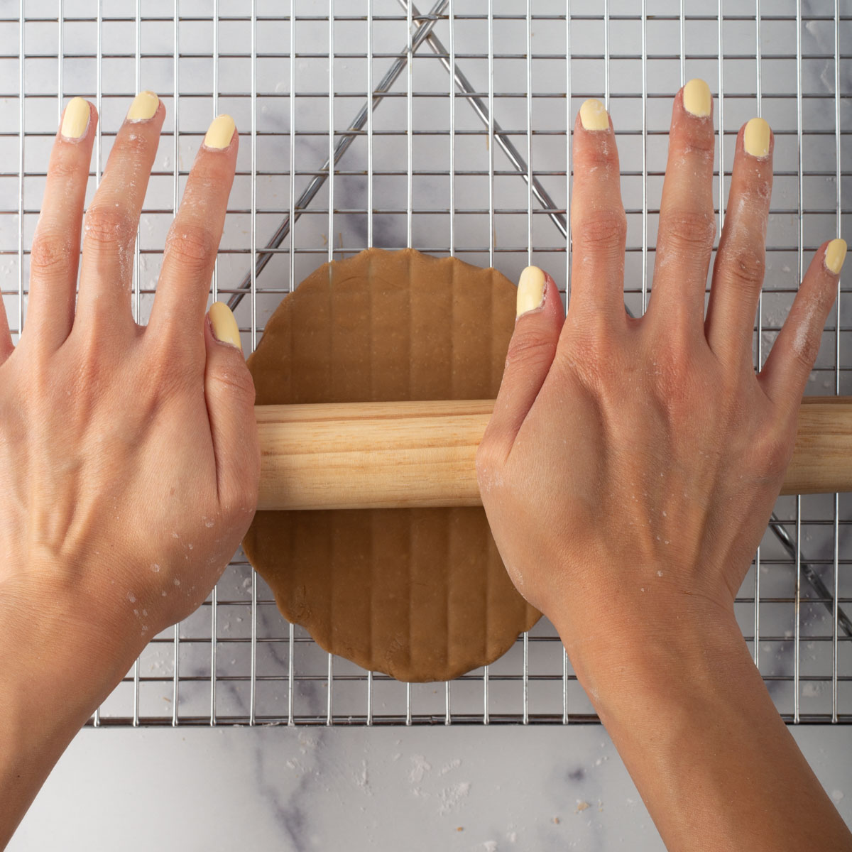 Roll out homemade boba dough on top of wire rack