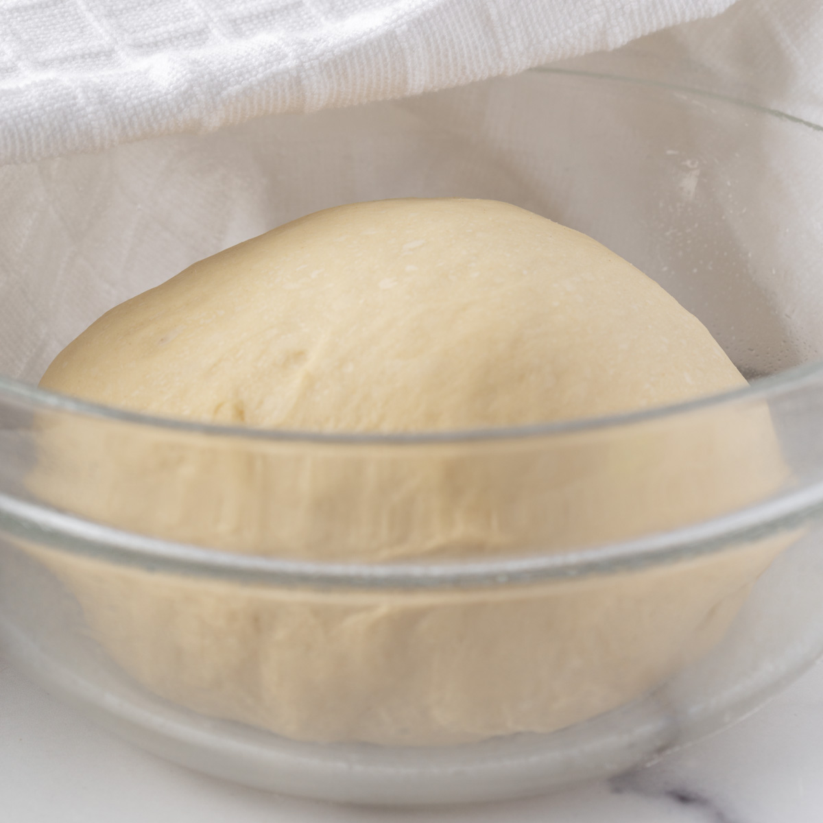 dough in a bowl waiting to rise