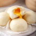 Close up shot of dripping egg custard bun