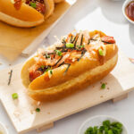 A close up of a Japanese topped hot dog