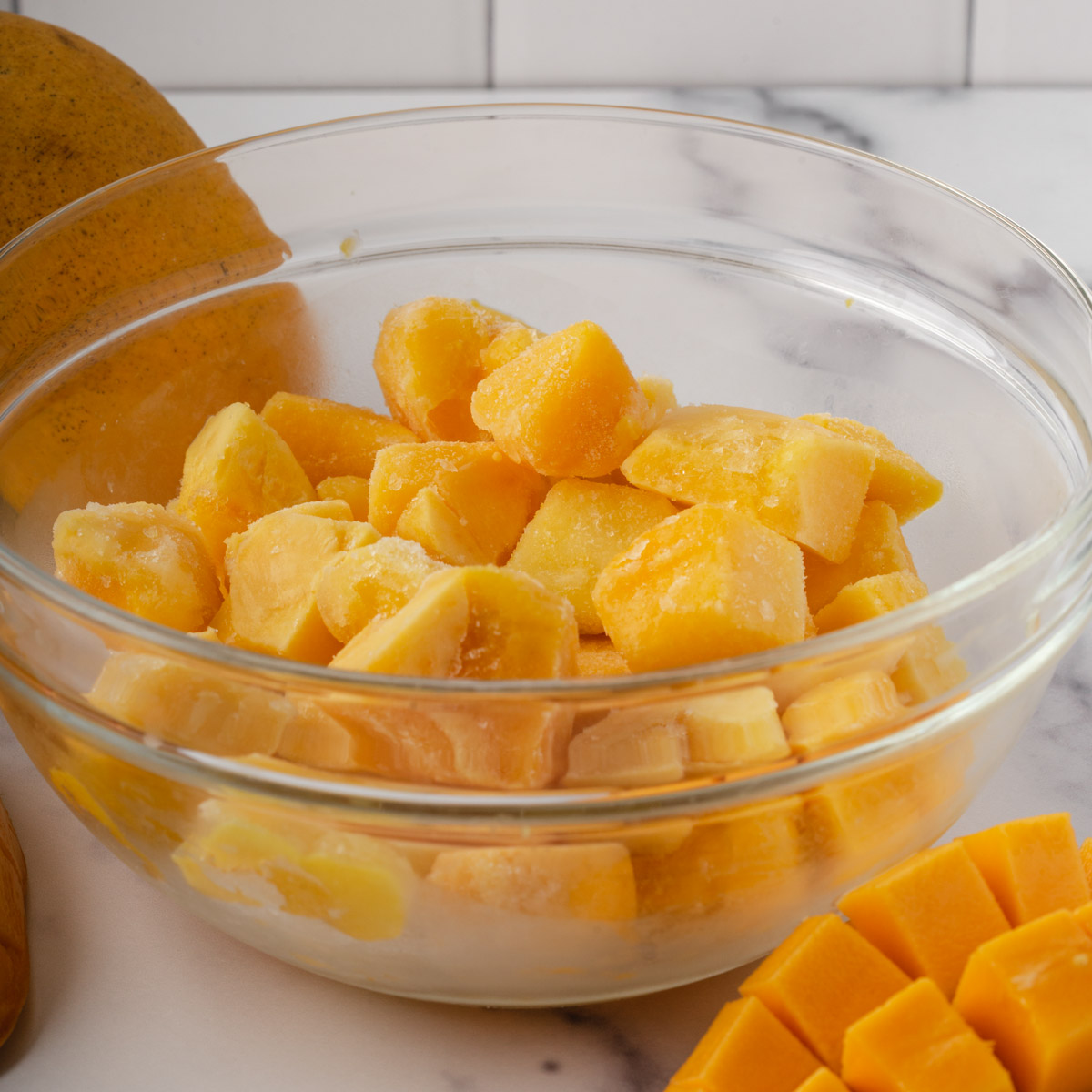 frozen mango chunks in a bowl