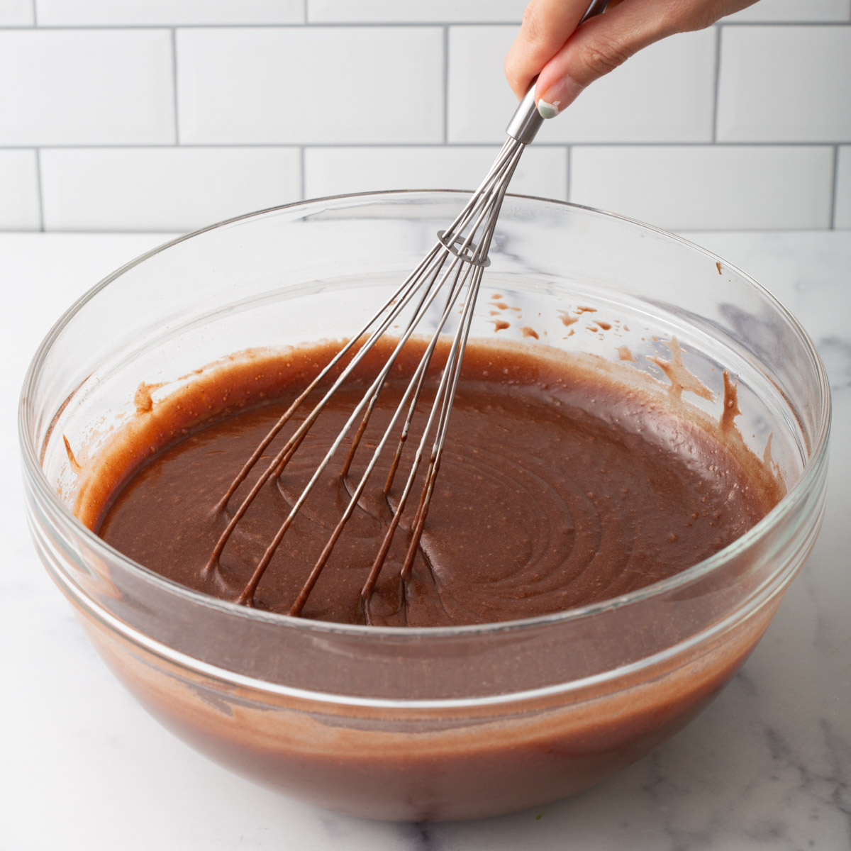 someone whisking mochi brownie batter