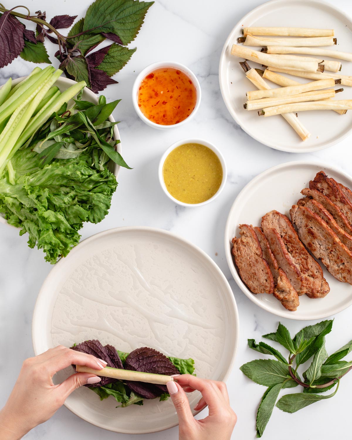 adding crispy onion straw to a spring roll