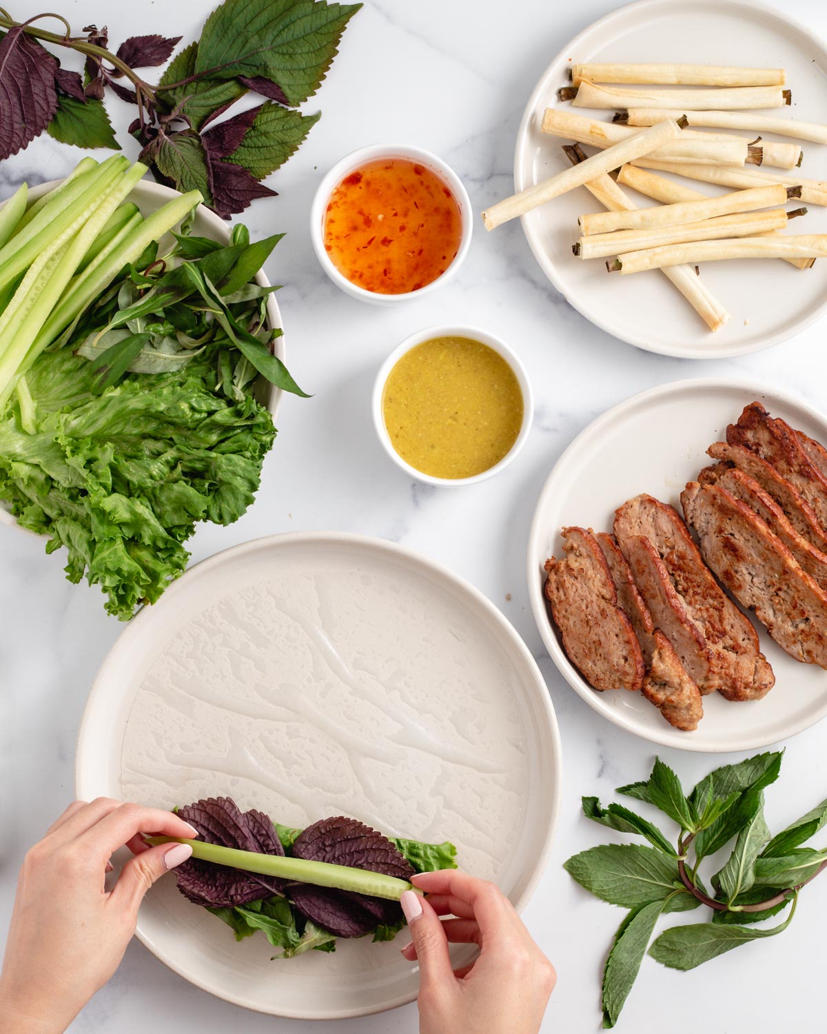 adding vegetables to a spring roll