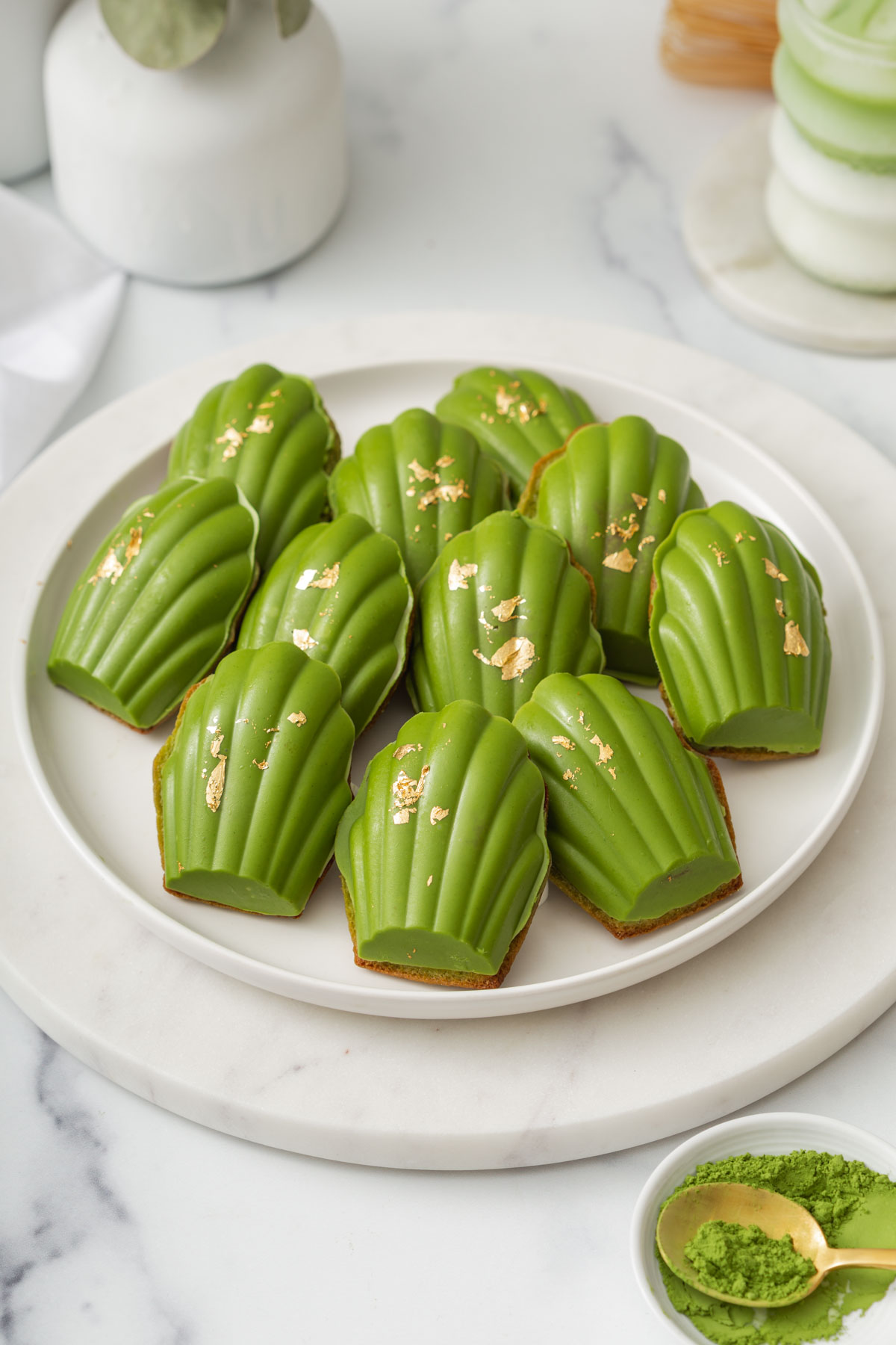 plate of matcha chocolate dipped madelines