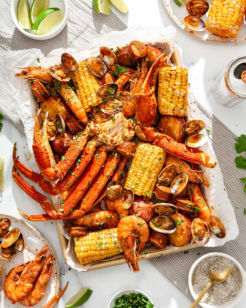 A tray of boiled Vietnamese cajun seafood on a table spread