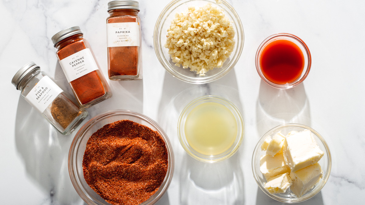 Seasonings for a cajun seafood boil on a table