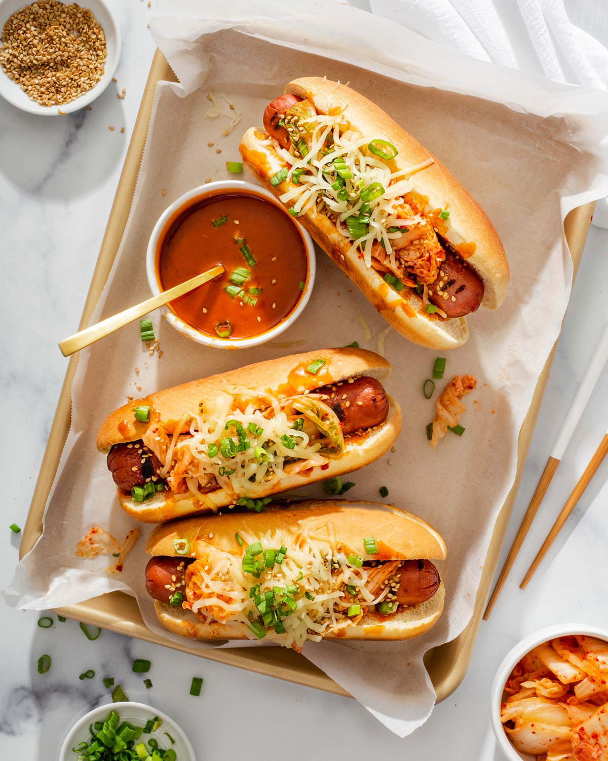 Three Korean style cheese dogs on a platter