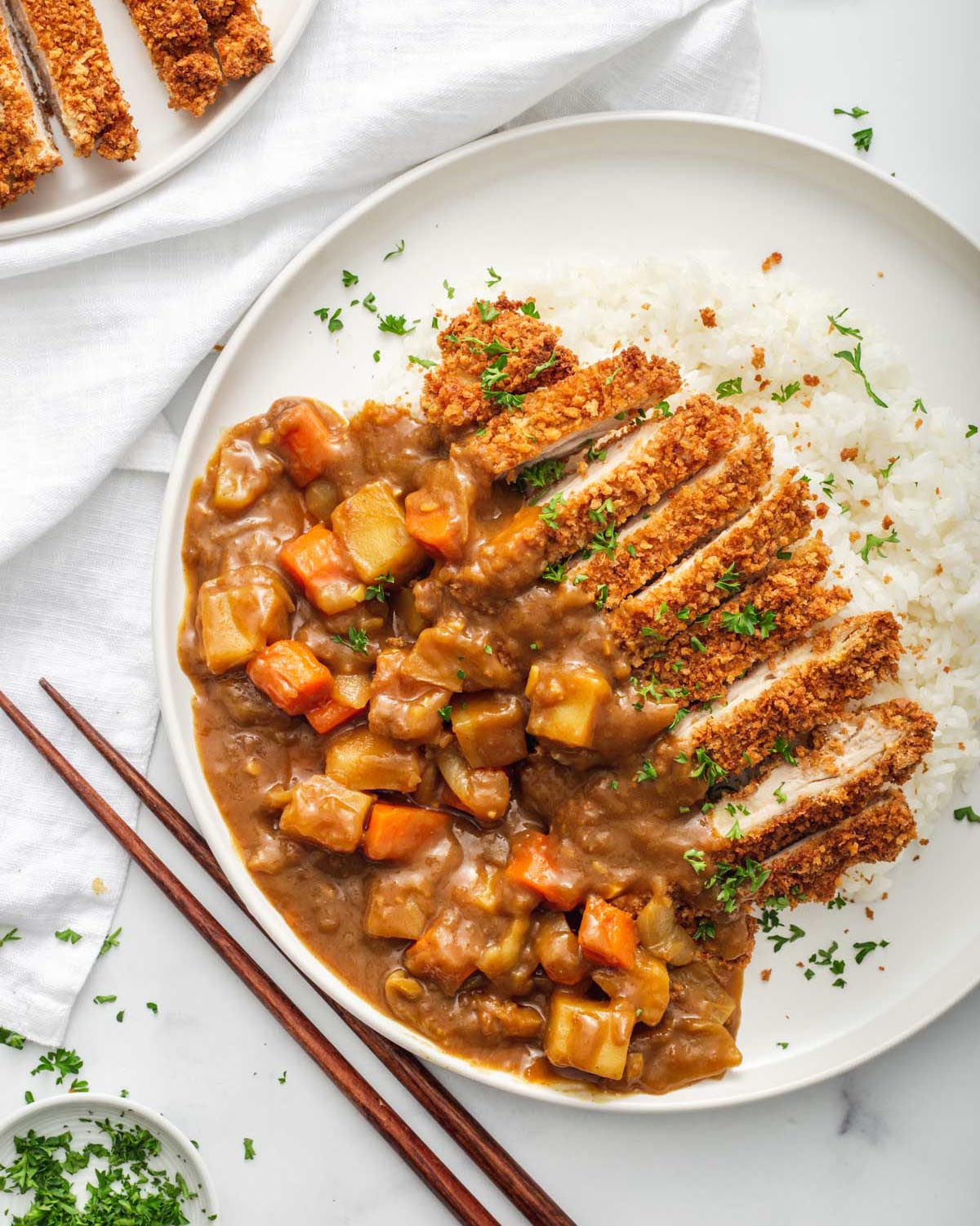 Looking down at a plate of chicken katsu curry