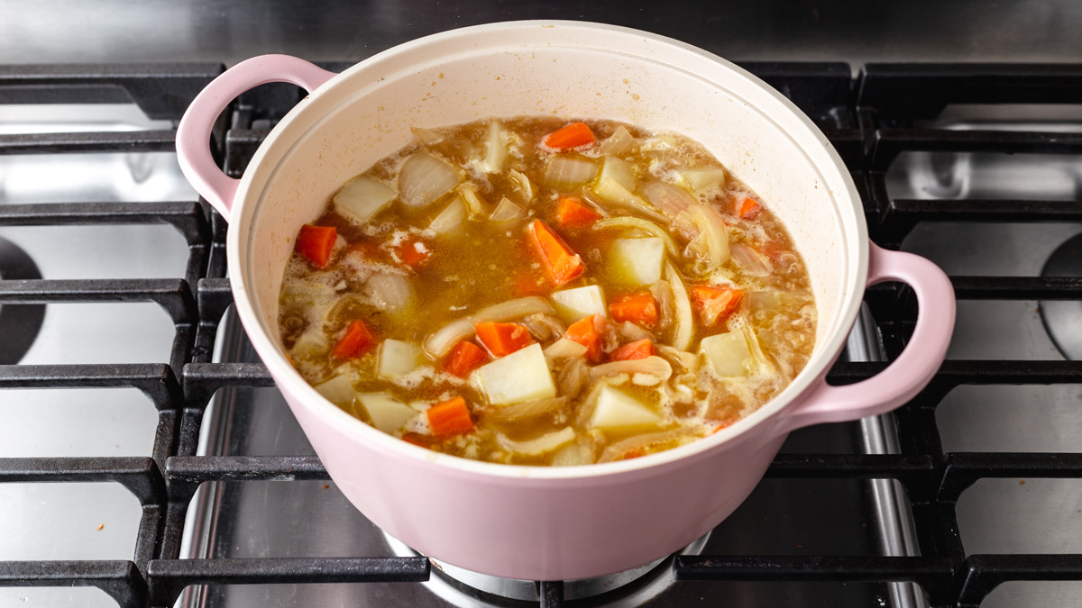 Simmering vegetables on the stove in a pot