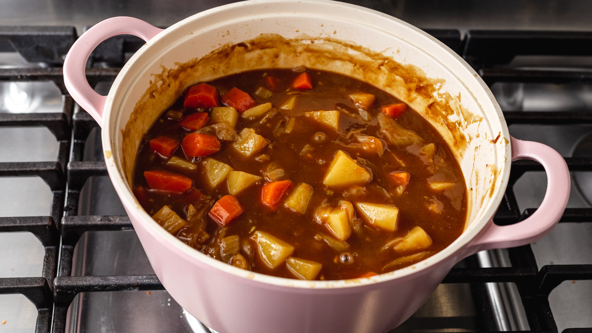 Japanese curry simmering on the stove in a pot