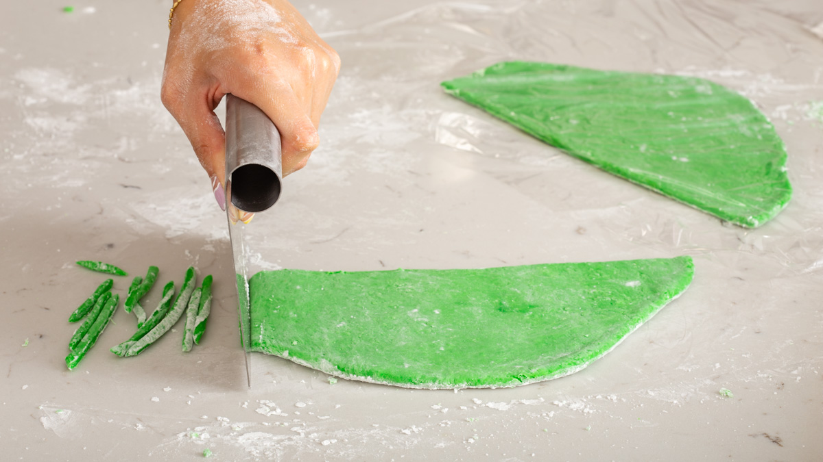 Slicing the gelatin mix into strips with a dough cutter