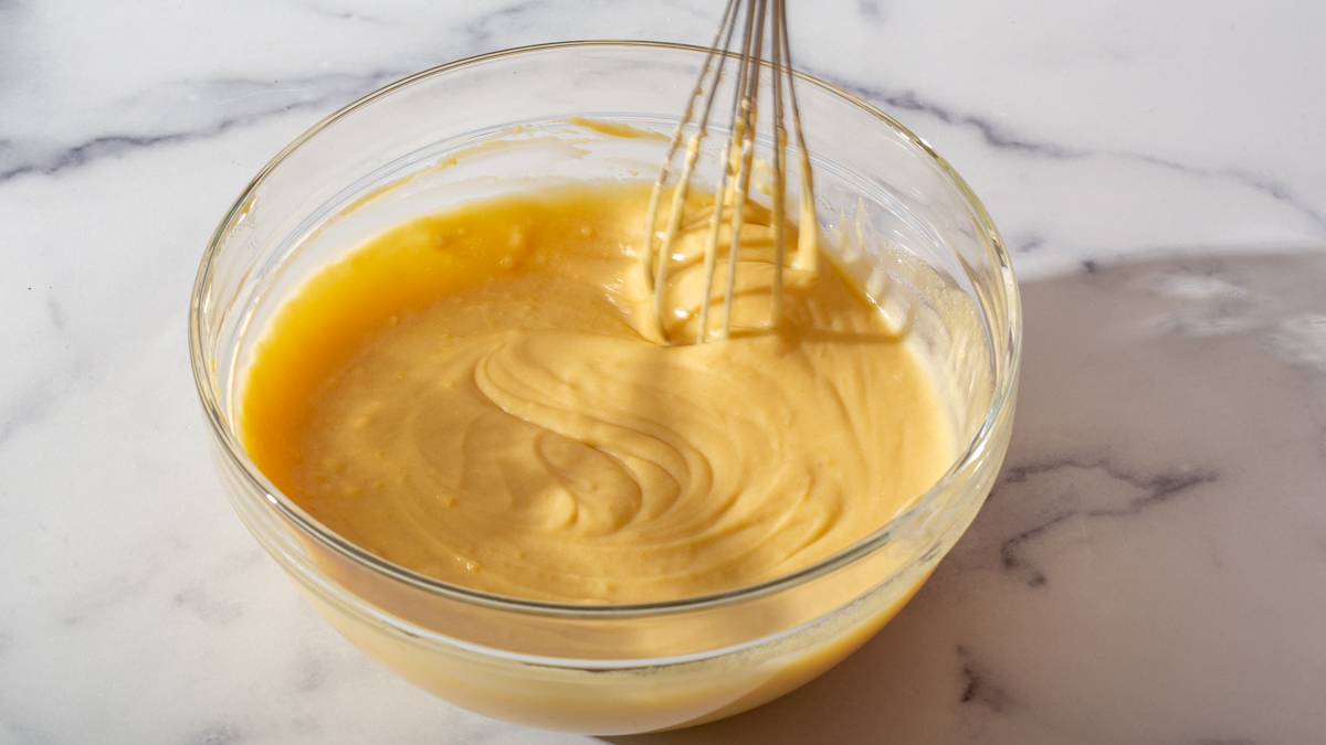 Whisked together liquid ingredients in a glass bowl