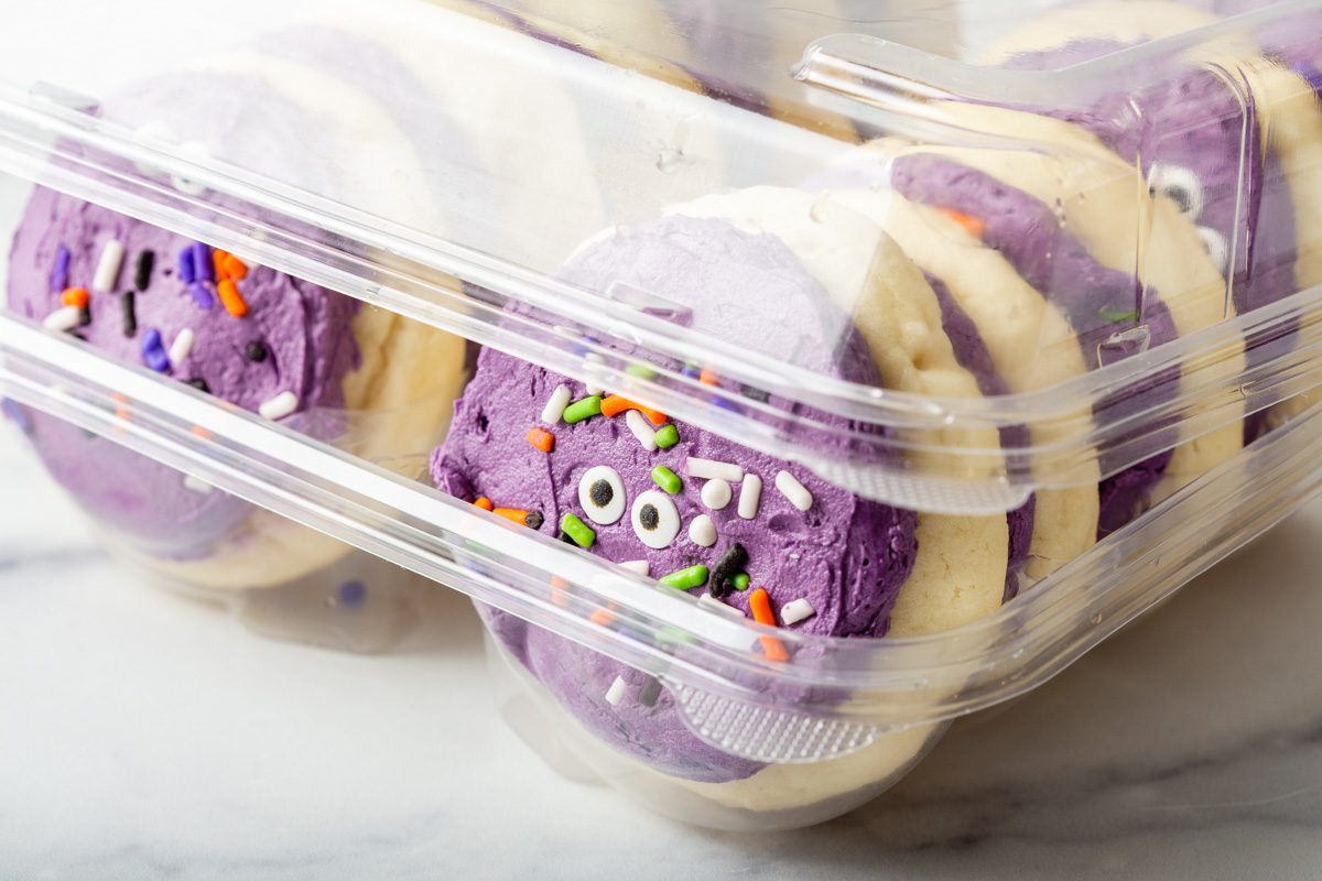 Ube loft house cookies inside a plastic container