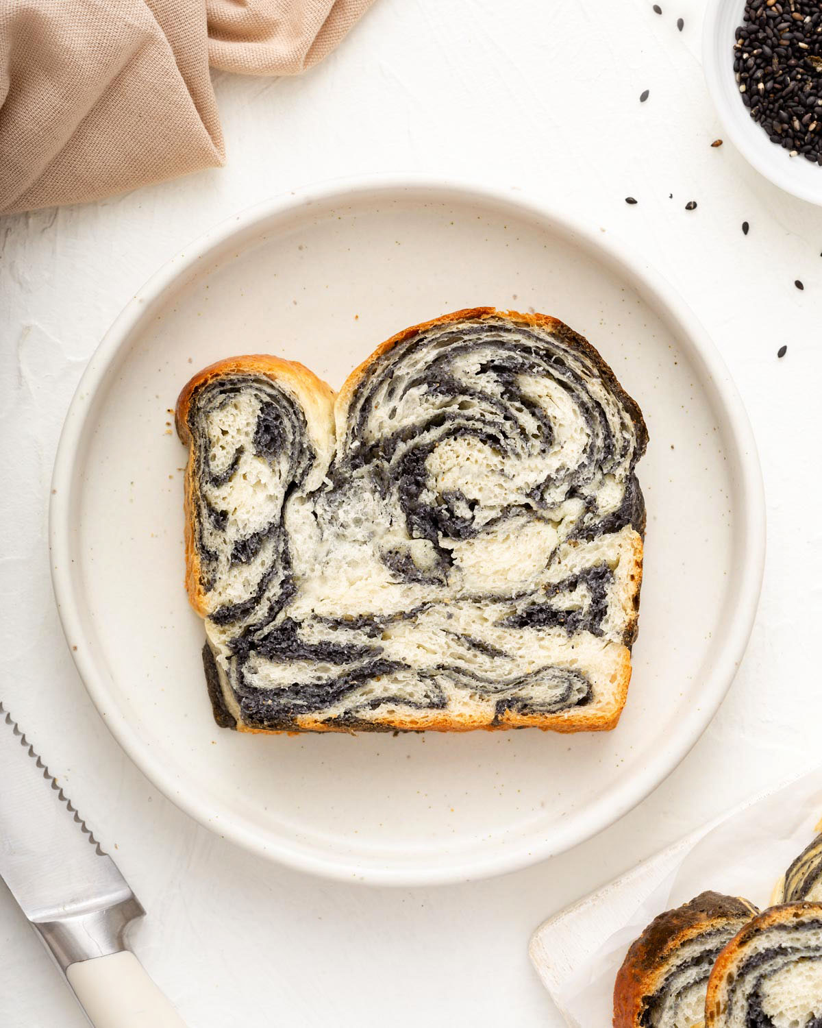 Looking down at a plate with marbled sesame milk bread