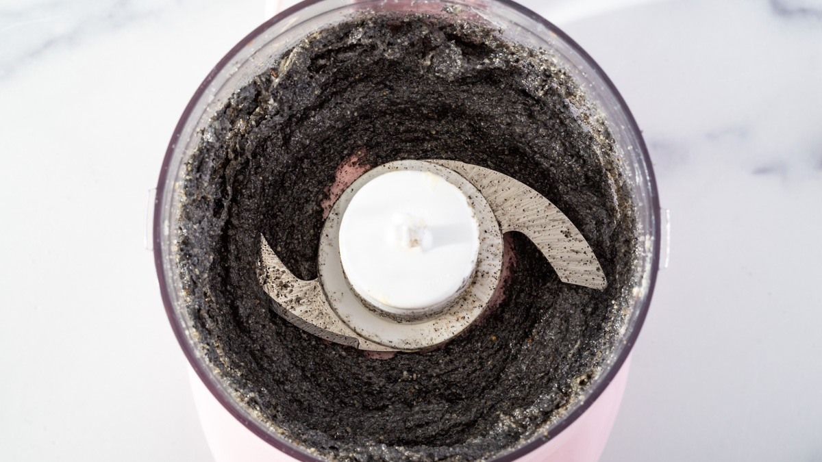 Pureed black sesame in a food processor.