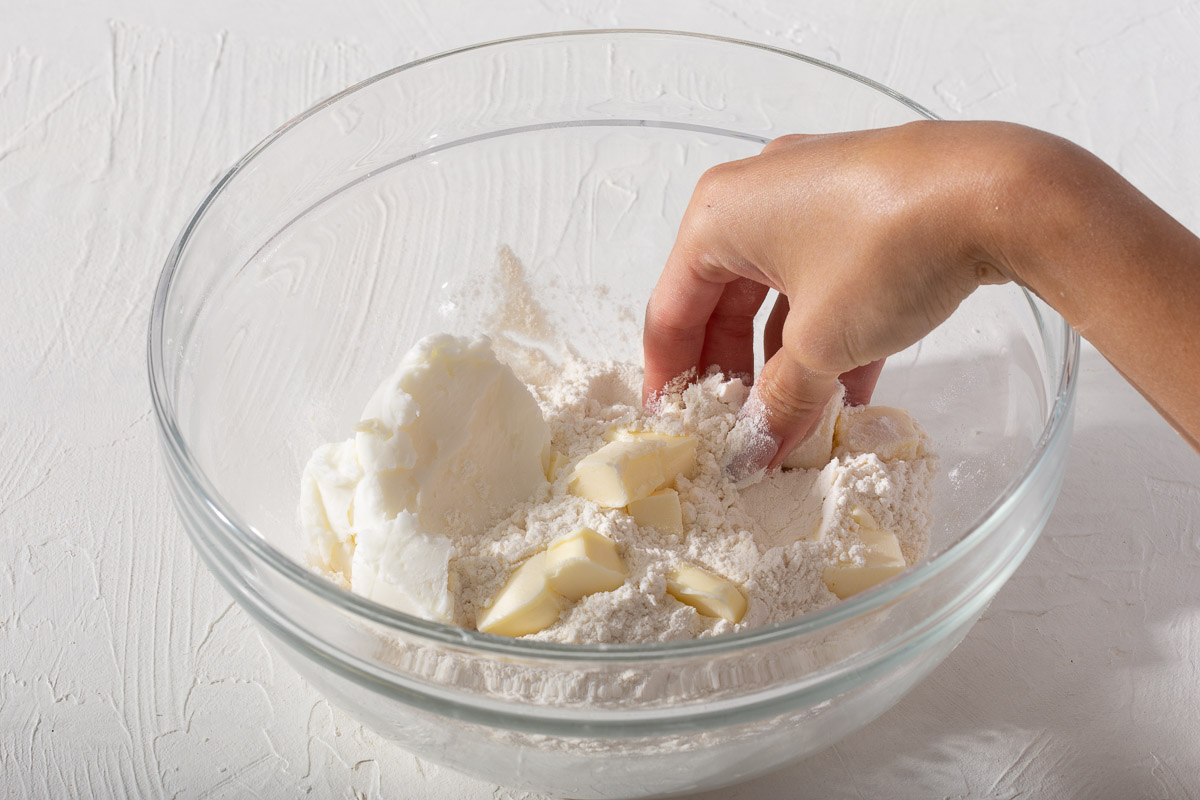 Mixing together butter flour and shortening