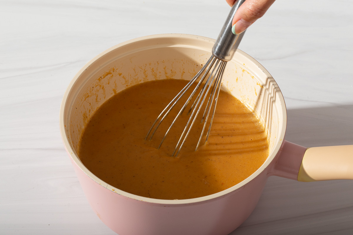 Whipping together the wet ingredients for pumpkin spice muffins