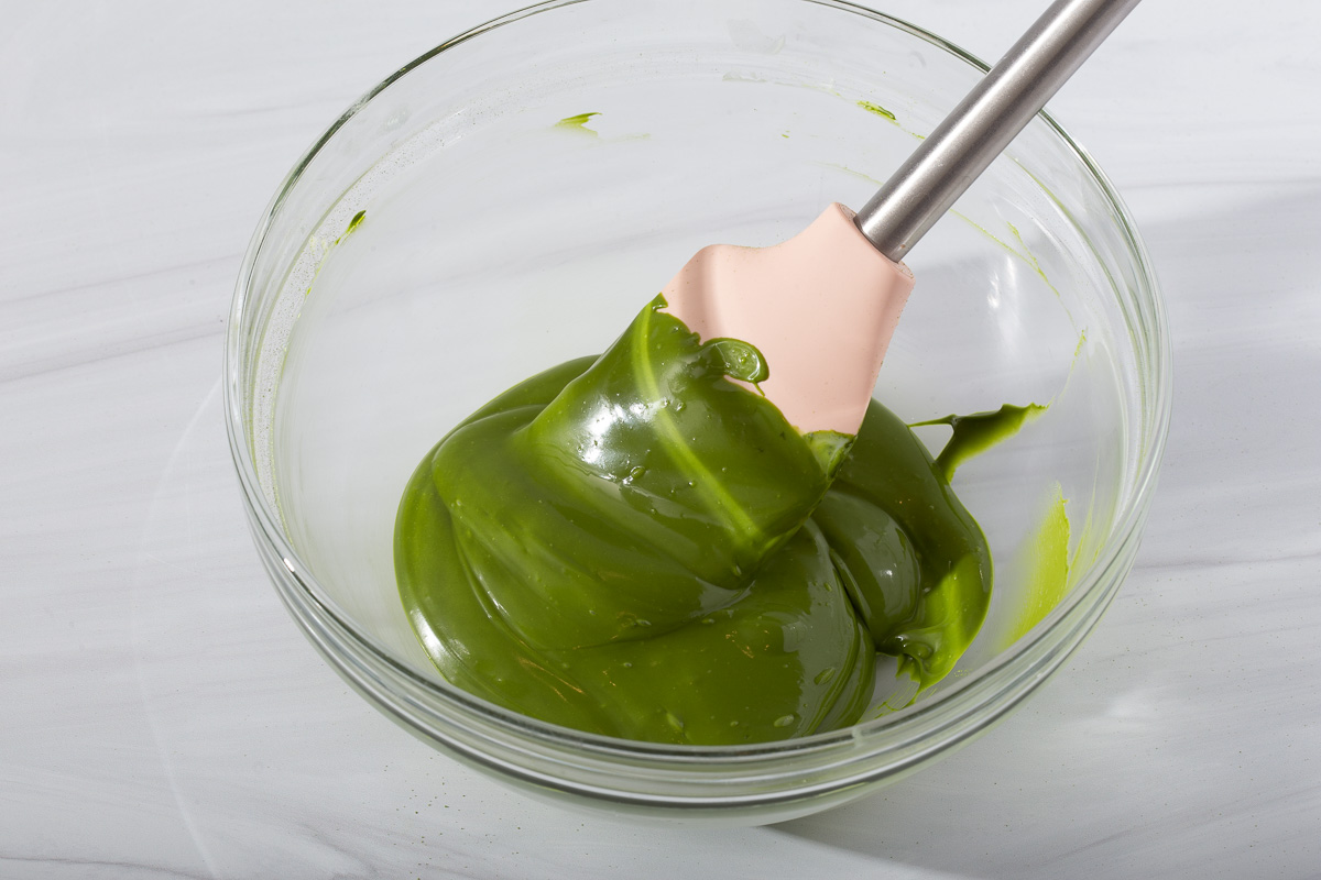 Mixing in the matcha powder to make a melted matcha chocolate mixture