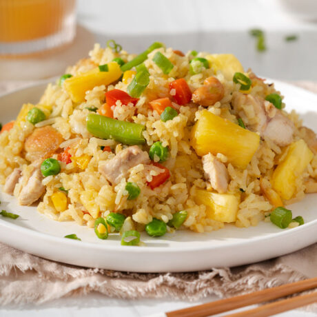 Up close of a plate of pineapple fried rice on a plate.