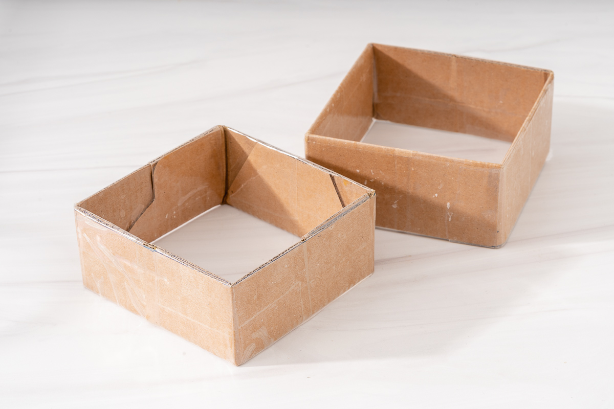 Small cardboard molds for making lunar new year banh chung.