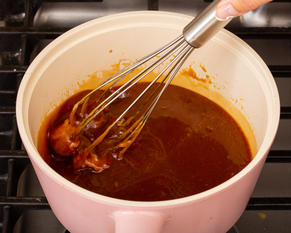 Blending white miso into the melted caramel sauce.