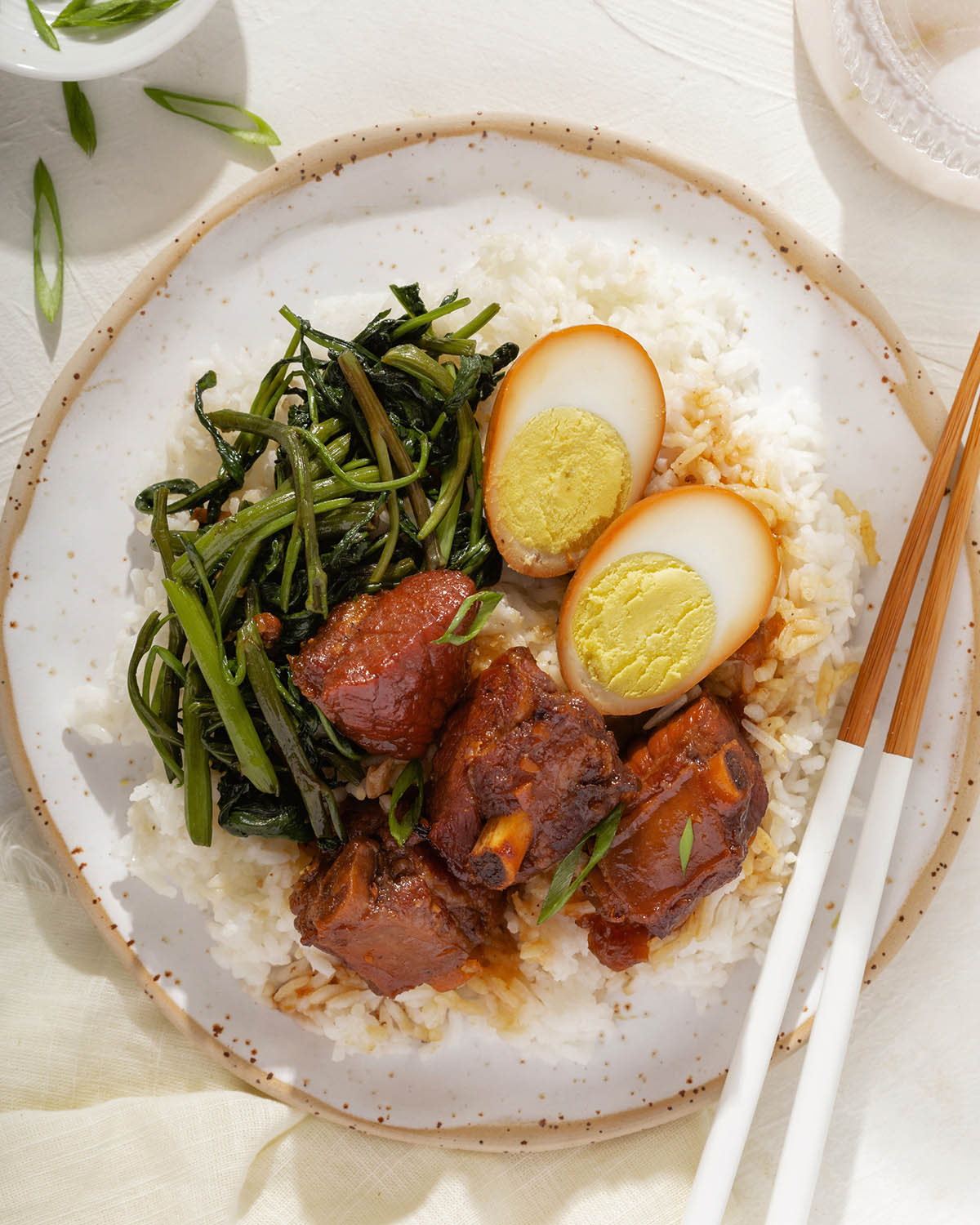 A plate of rice topped with Vietnamese caramelized braised pork ribs.