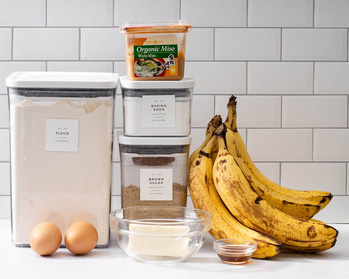 All the ingredients needed to make miso banana bread on a counter.