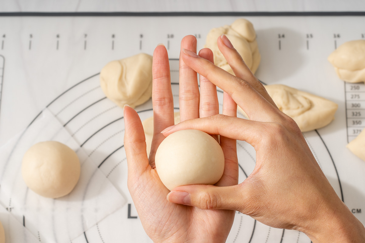 A perfect rolled ball of dough ready for resting.