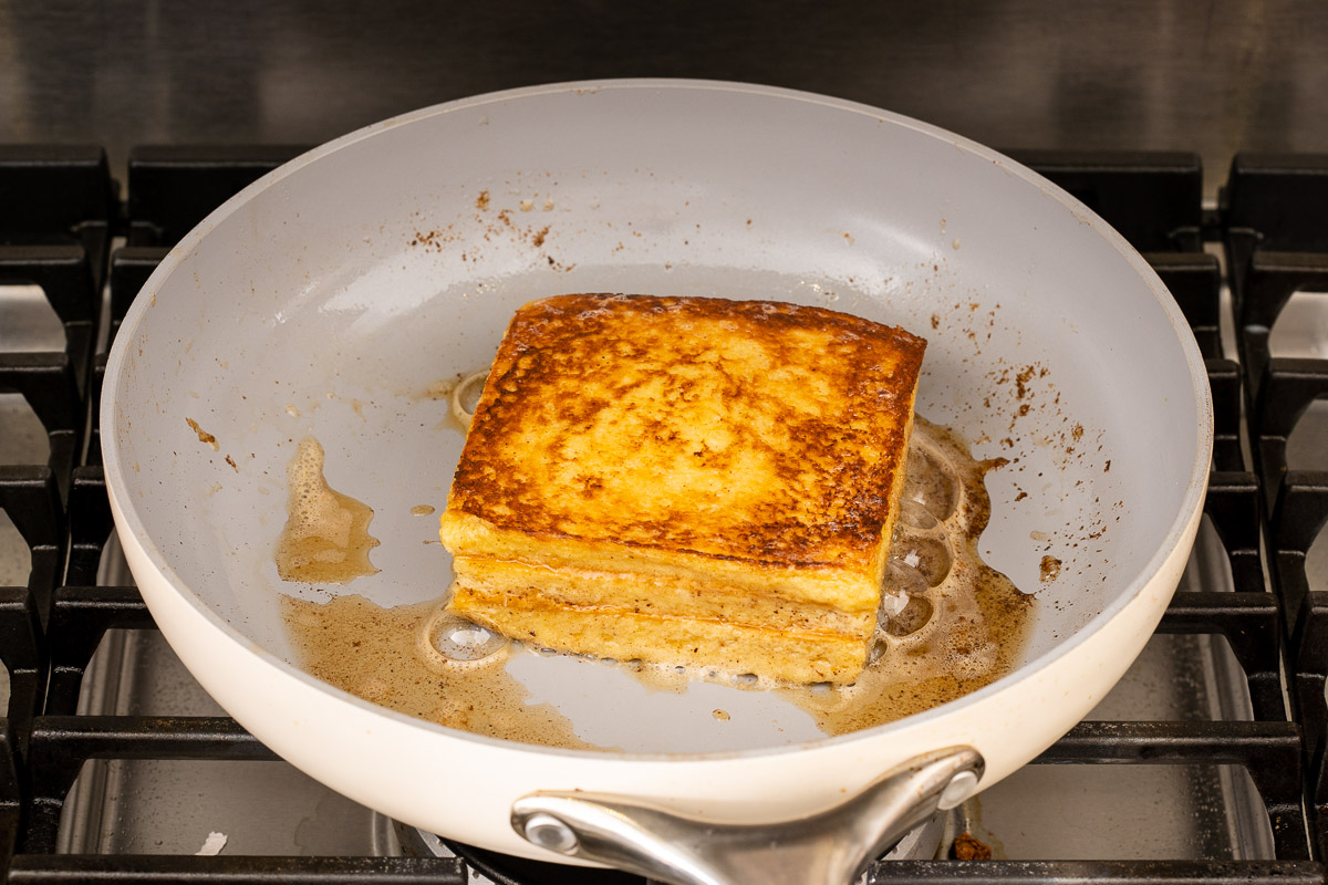 A full cooked Hong Kong French toast in a deep skillet.