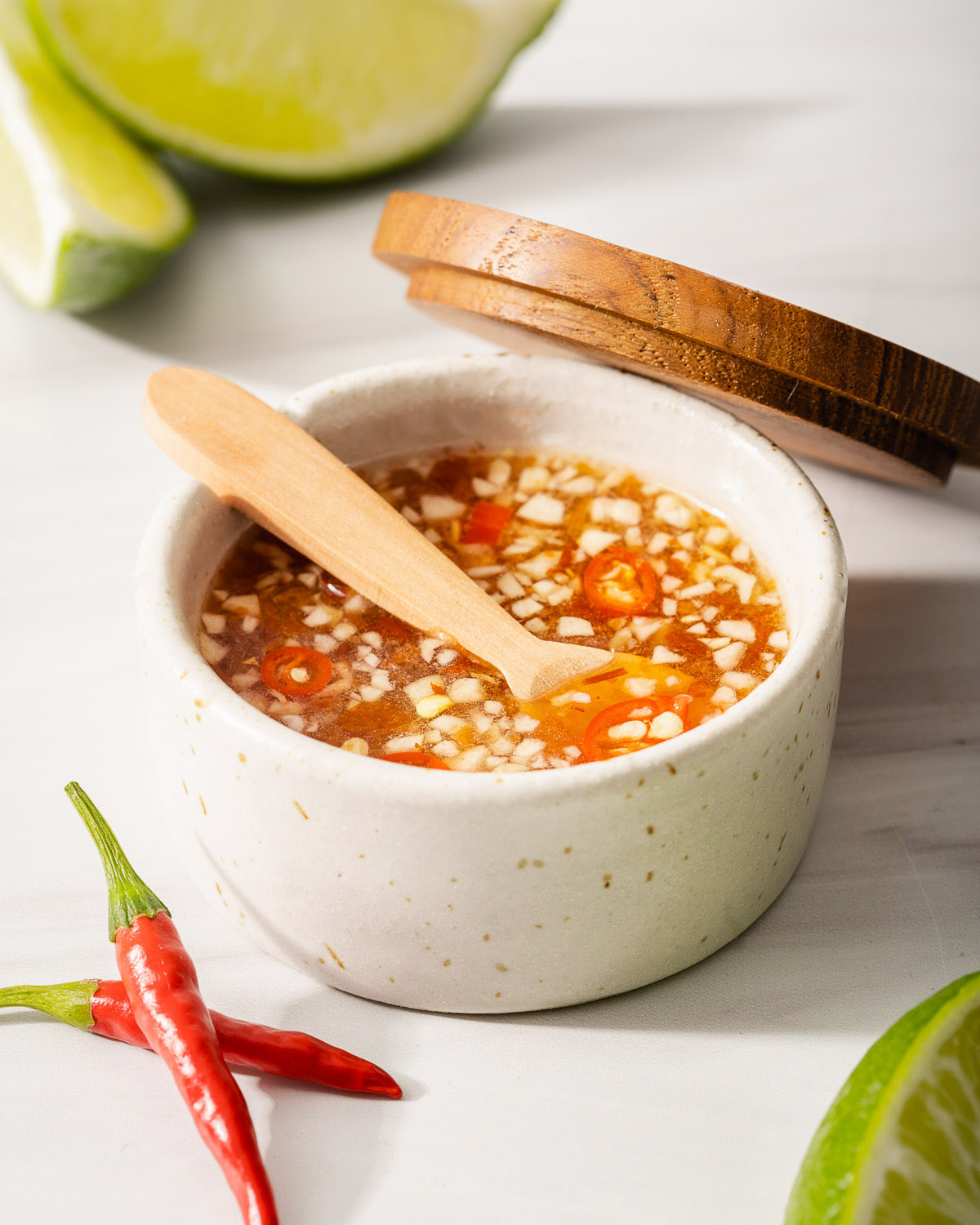 A small jar of Nuoc cham dipping sauce.
