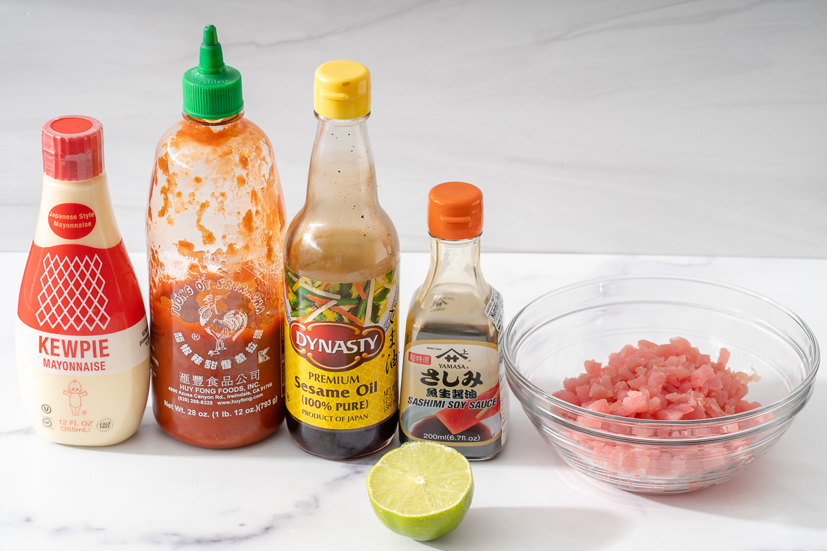 All the sauces and ingredients necessary to make spicy tuna poke.