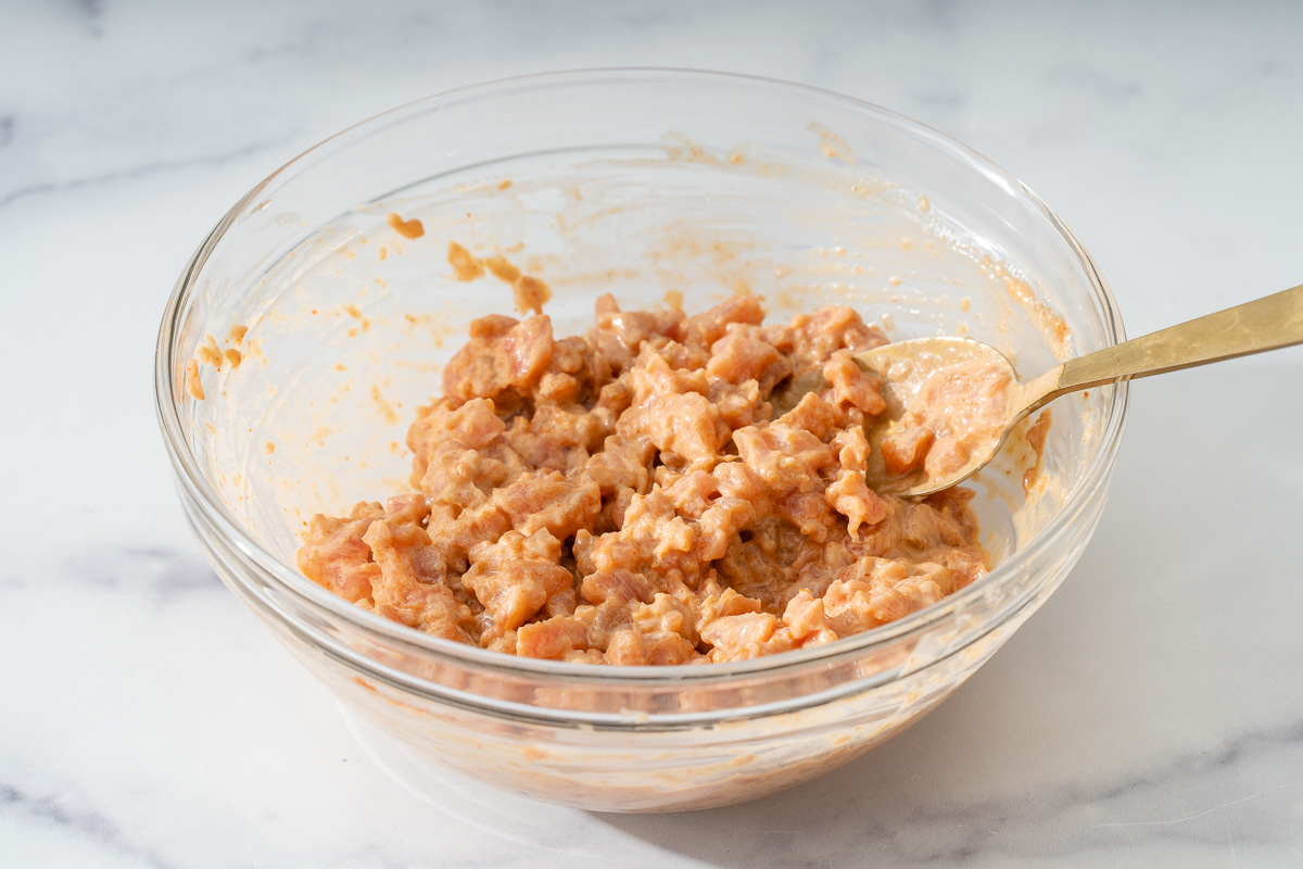 A small glass bowl with freshly mixed spicy tuna.