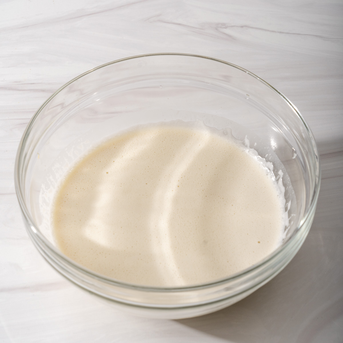 The mung beans blended with coconut milk in a large bowl.