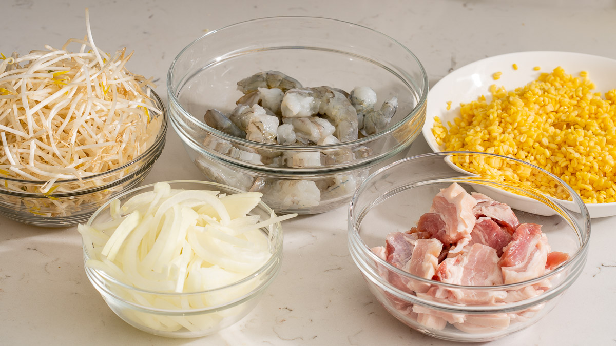 All of the filling ingredients for a traditional bánh xèo Vietnamese crepe.