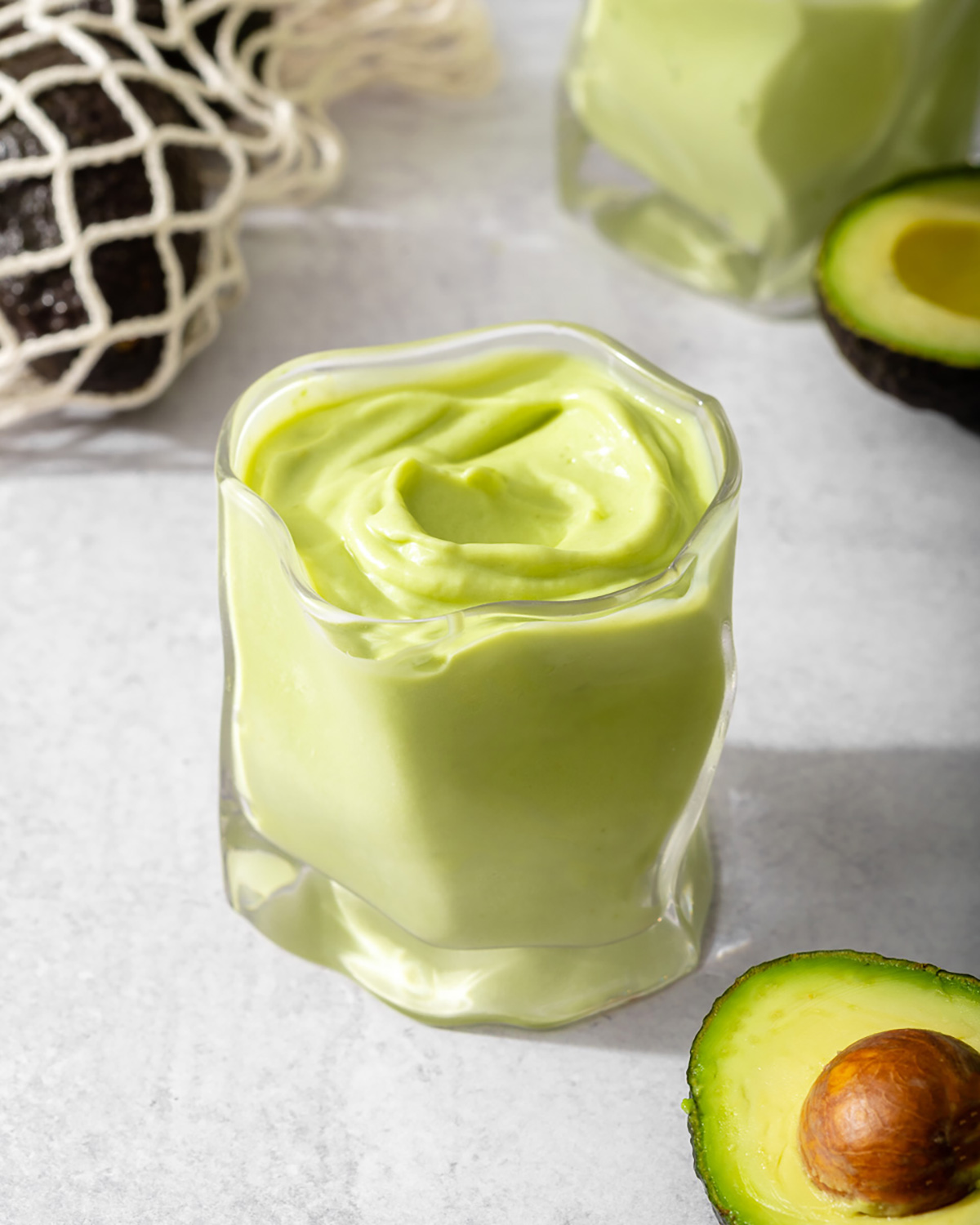 Up close of a glass of Vietnamese avocado smoothie.