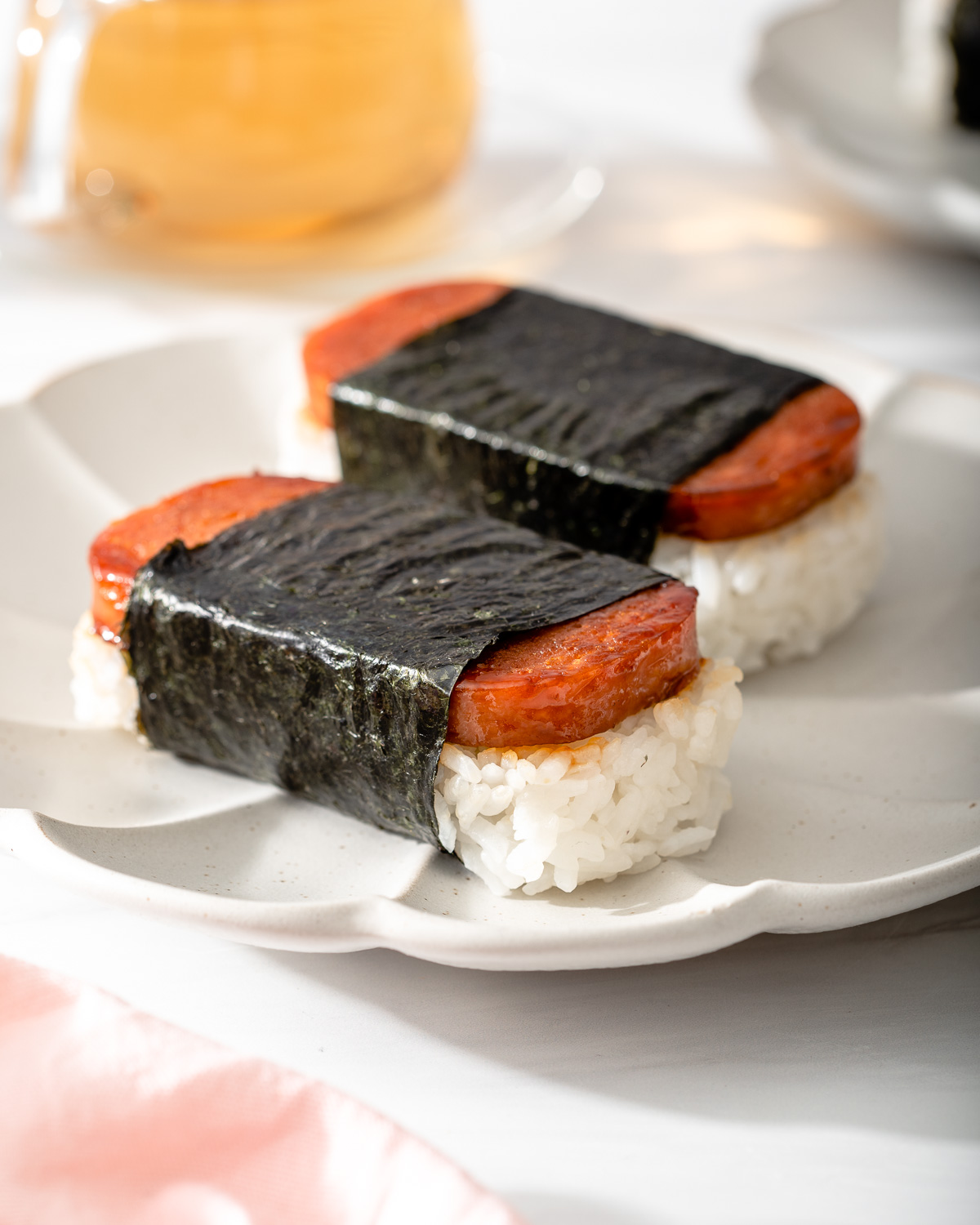 Two Hawaiian spam musubis on a plate.