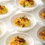 Up close of several steamed Vietnamese rice cakes on a table.