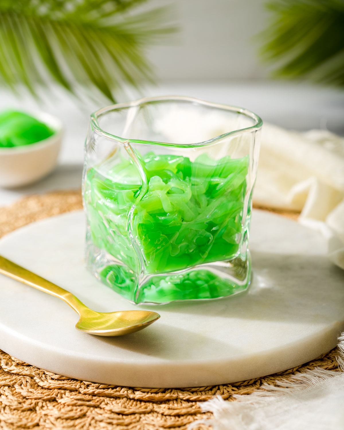 A glass of pandan cendol ready for coconut juice.