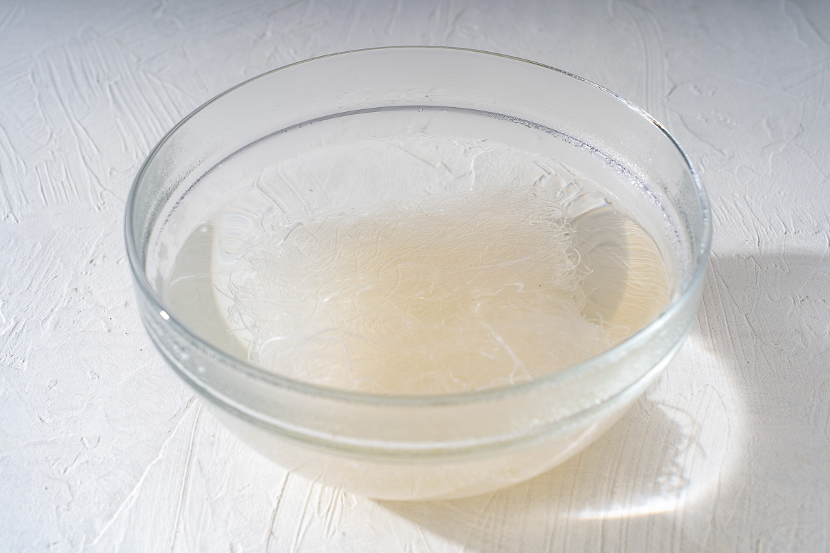 Bean Thread noodles soaking in water to soften.