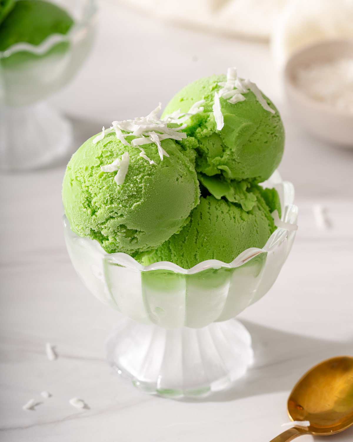 A few scoops of pandan ice cream in a small serving bowl.