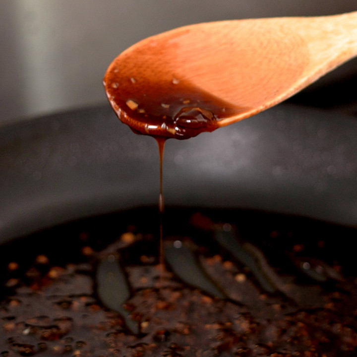 Teriyaki sauce that has been reduced down and is ready for tossing.