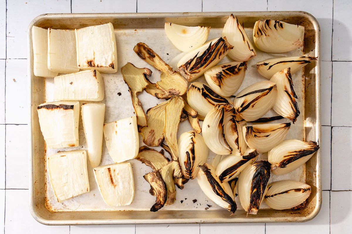 Ginger, daikon, and onions charred in the oven to release more flavor.
