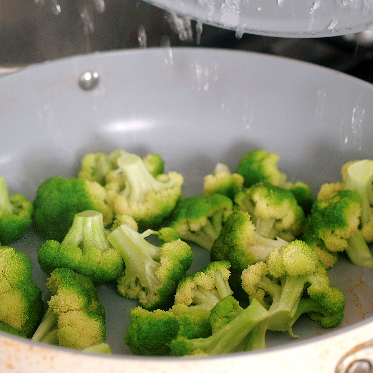 Lightly steaming the broccoli before cooking with the beef and sauce.